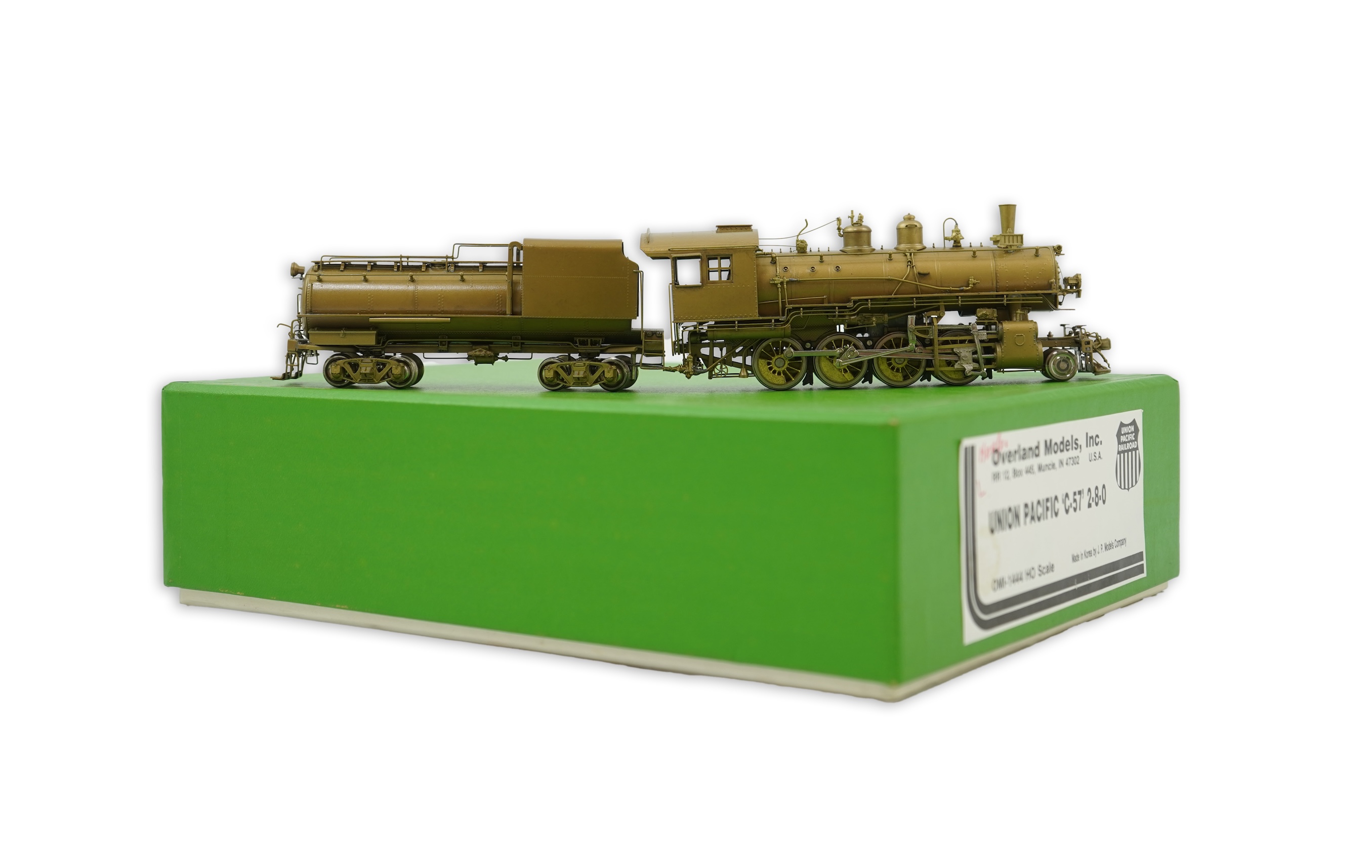 A boxed HO gauge Overland Models Inc. J.P.M. unpainted brass model of Union Pacific Railway C-57, 2-8-0 locomotive with bogie tender, powered for two rail operation.